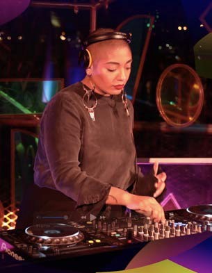 DJ Pam Jones playing music at museum event