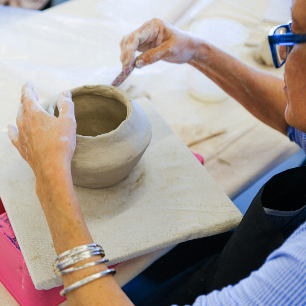 Person crafting ceramic clay bowl