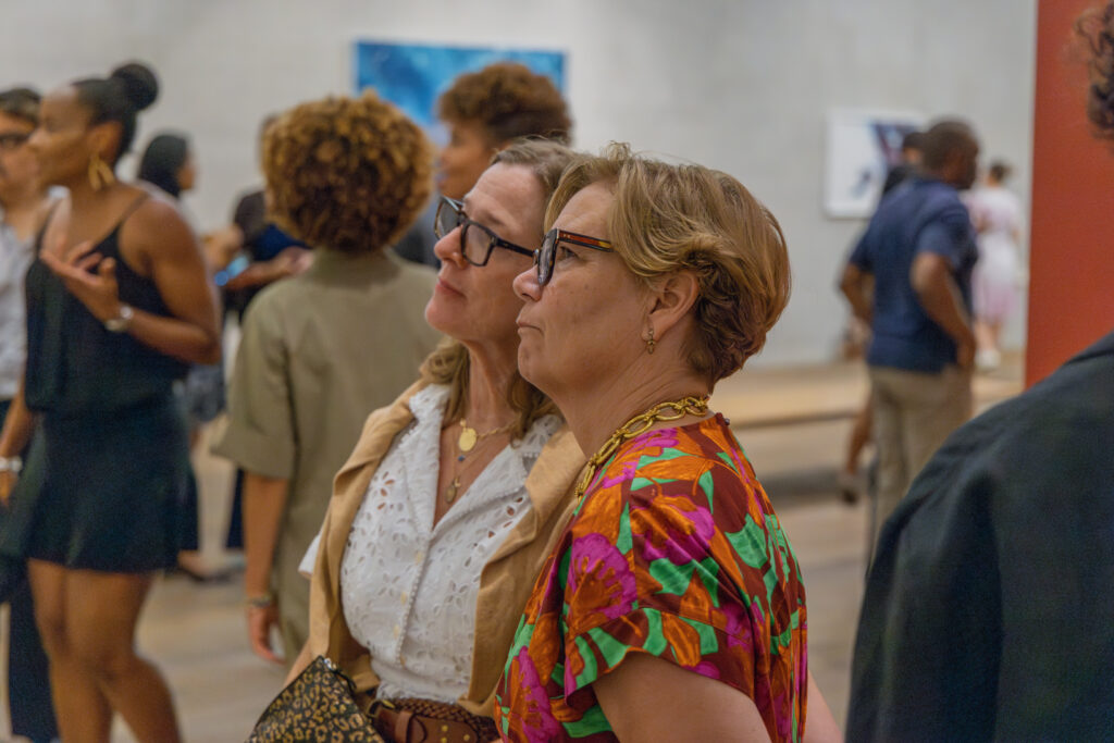 two women looking at art