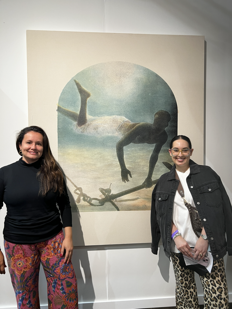 PAMM Associate Curators Jennifer Inacio and Maritza Lacayo standing in front of new aquisition