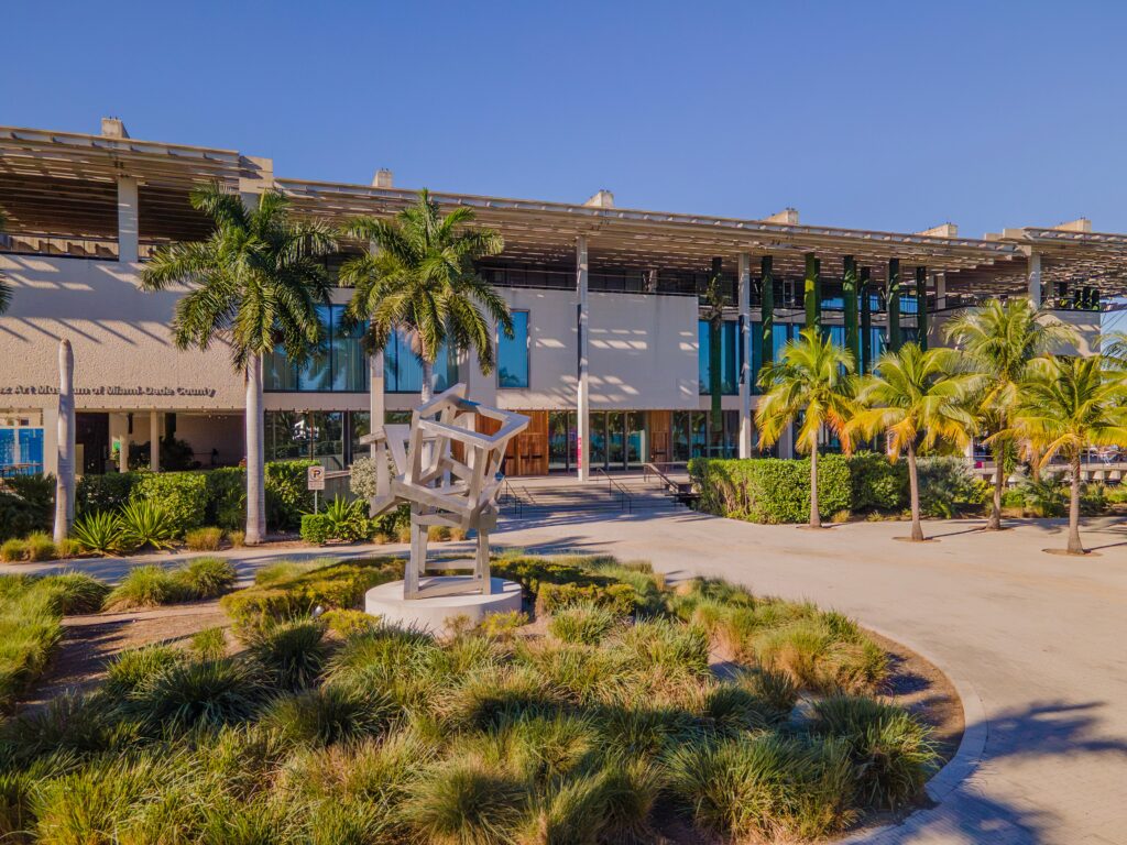 View of the museum behind palm trees